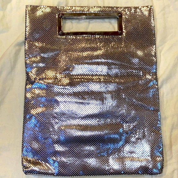 Express Silver folding Clutch with magnetic handles.